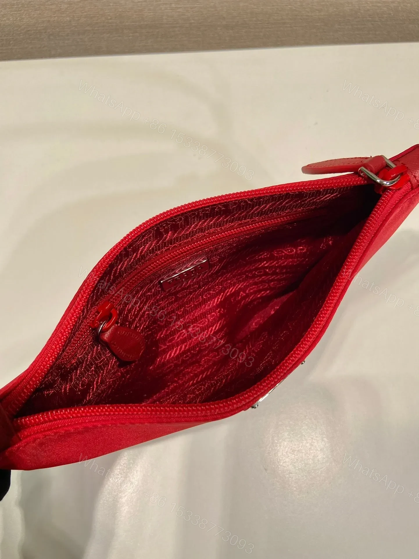 View 6 of SHOULDER BAG 24 WITH TRIANGLE LOGO IN PASSION RED RE-NYLON FABRIC