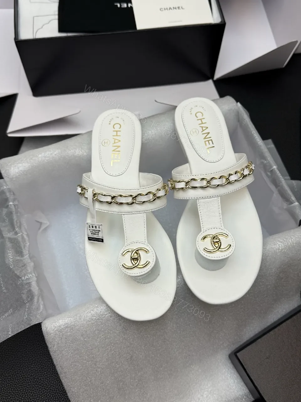 Elegant White Leather Sandals with Gold Chain Accent — view 1