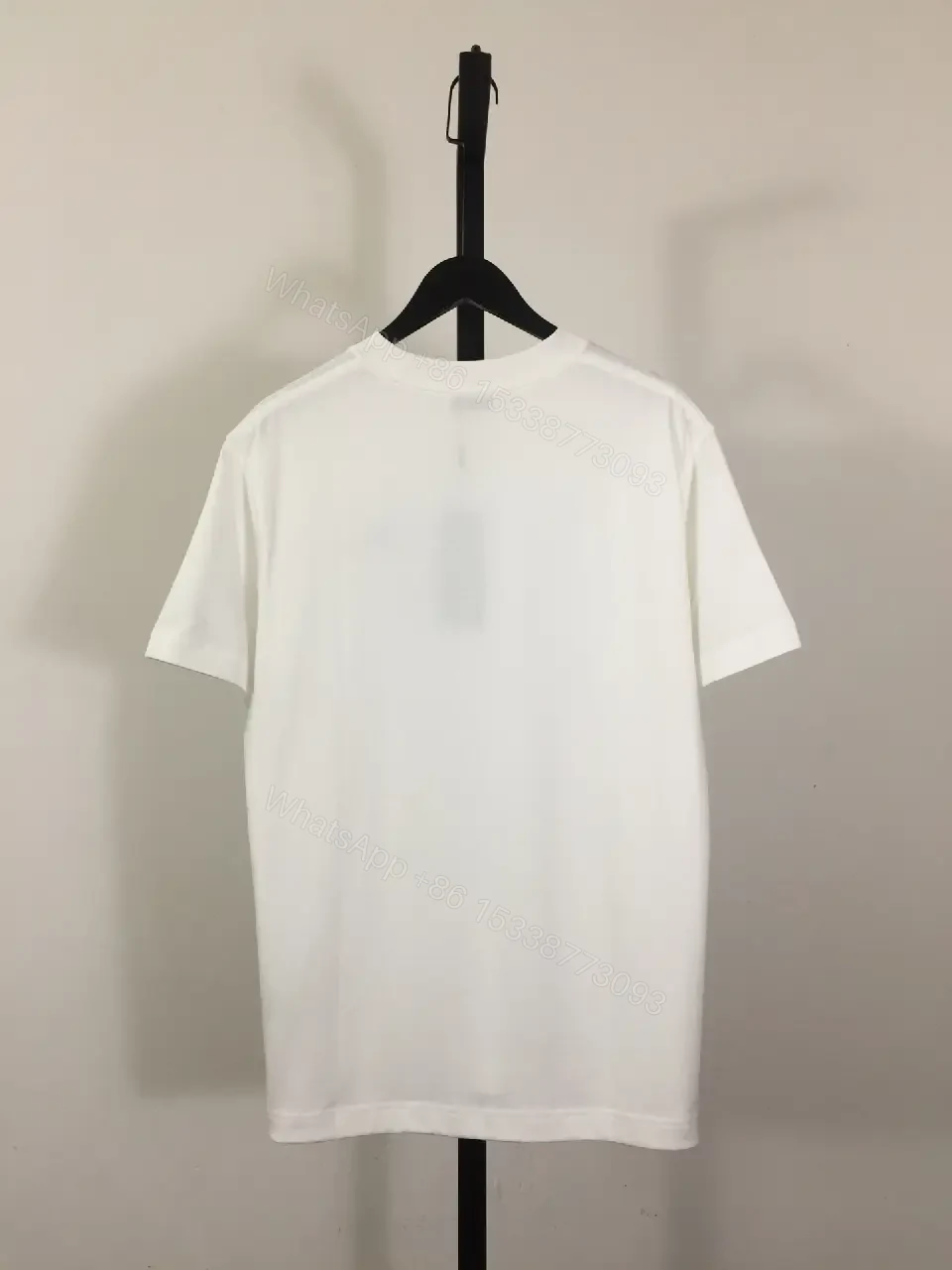 View 5 of Minimalist White Tee: Premium Cotton, Subtle Logo, Classic Fit tee