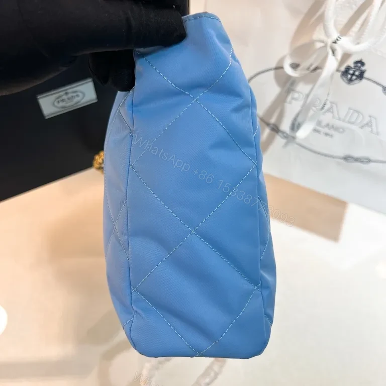 View 9 of Sky-Blue Quilted Nylon Shoulder Bag with Gold Chain - Luxury Prada-Style