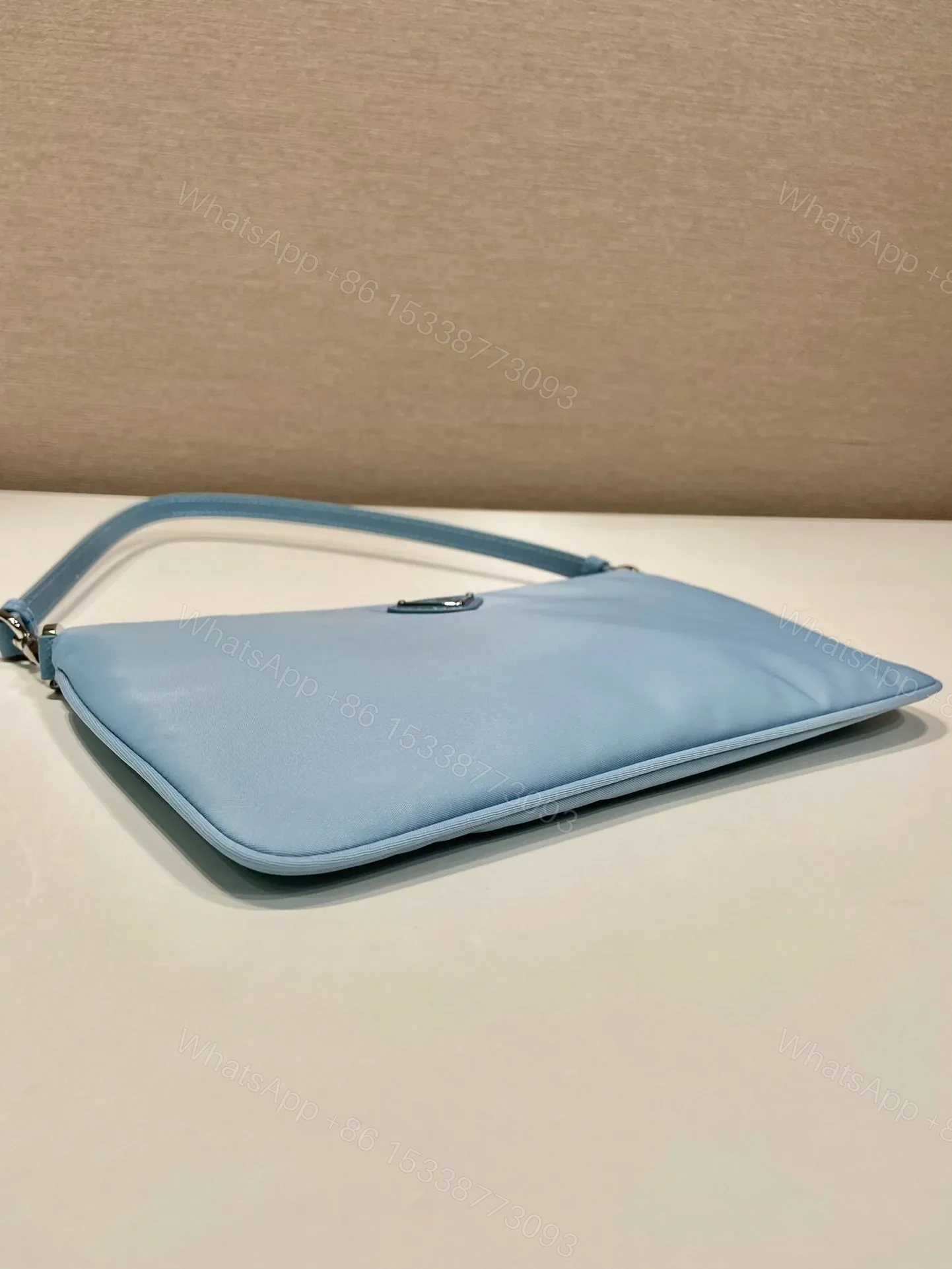 View 3 of SHOULDER BAG 24 WITH TRIANGLE LOGO IN SKY BLUE RE-NYLON FABRIC