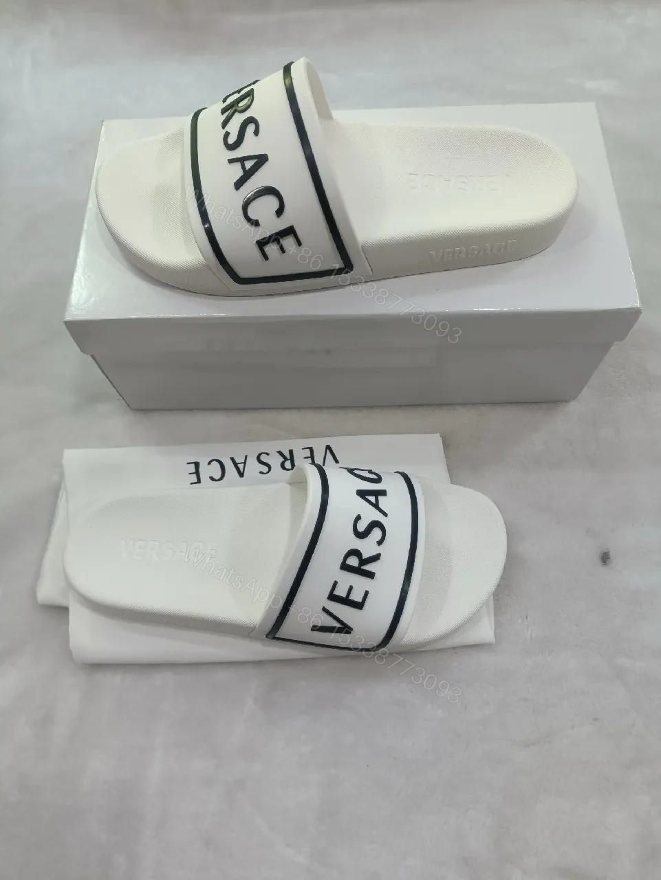 View 3 of White Leather Slide with Bold Brand Stripe, Unisex Comfort
