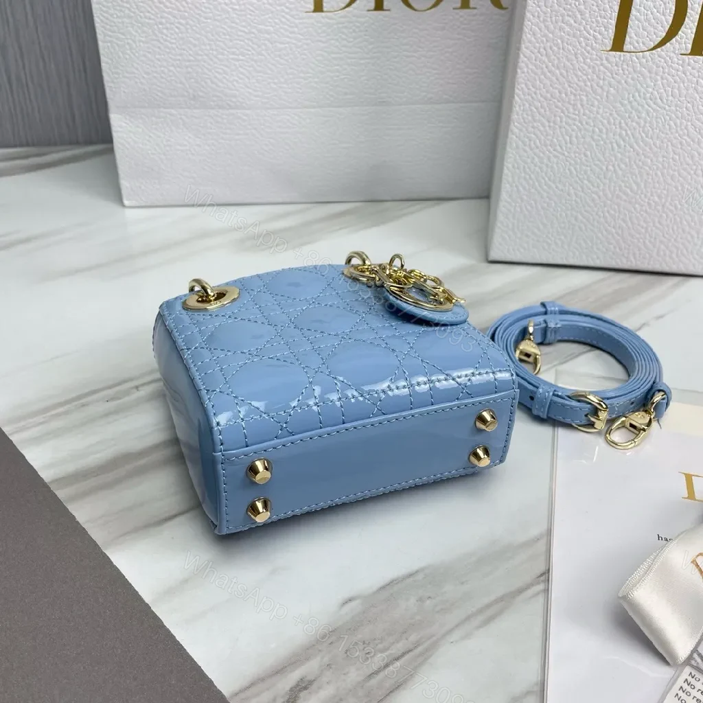 View 2 of Blue Quilted Mini Bag - Calf Leather, Crossbody/Top Handle, Magnetic Closure