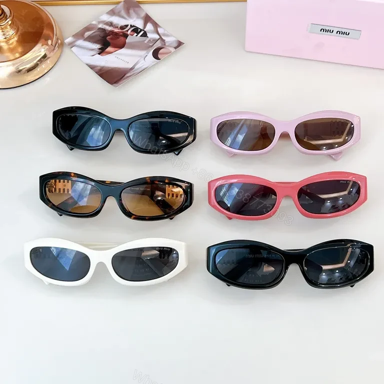 View 2 of Chic Black Miu Miu Sunglasses with Gold Accent - All-Day Shield