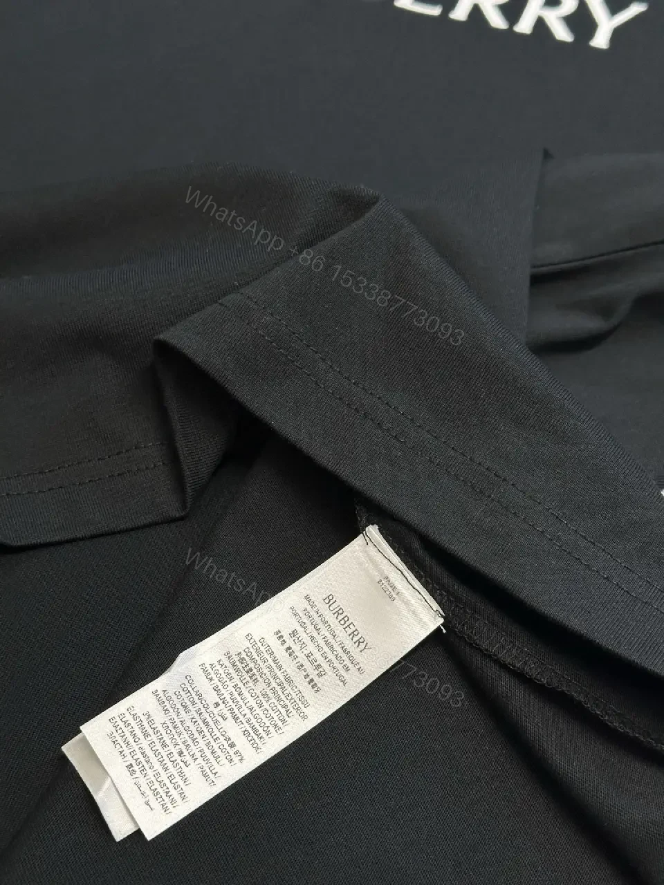View 10 of Minimalist Black Cotton Tee | Relaxed Fit, Logo Accent, Everyday Luxury