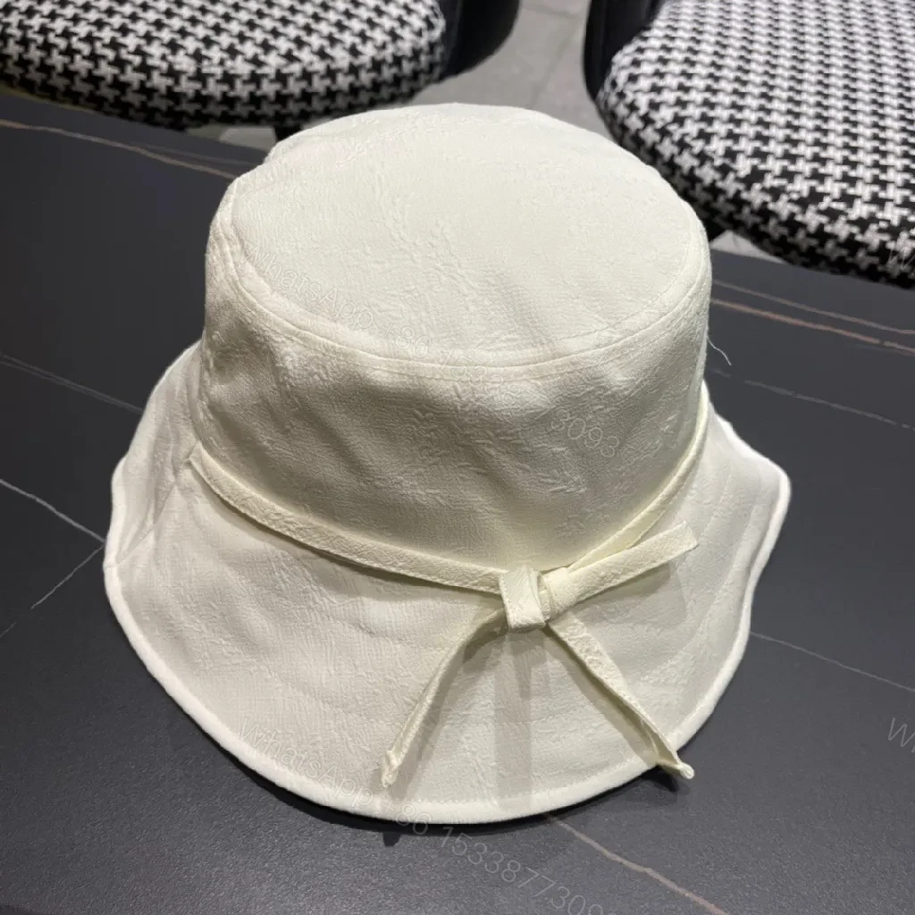 View 2 of Compact Luxury Bucket Hat with TriangleEmblem, Off-White, Textured Weave