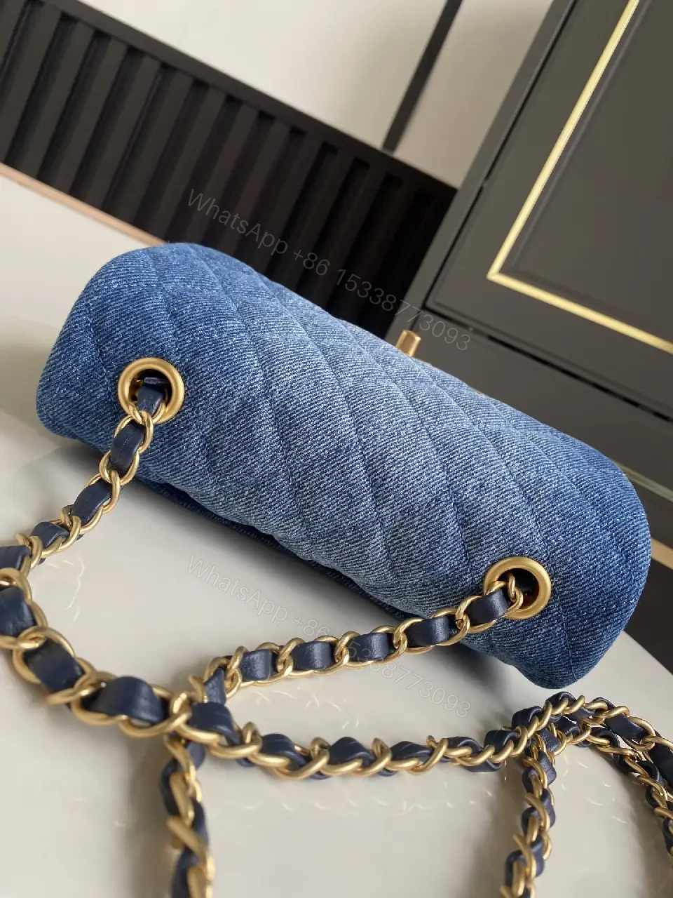 View 2 of Light Blue Denim Quilted Flap Bag with Gold CC Chain Strap