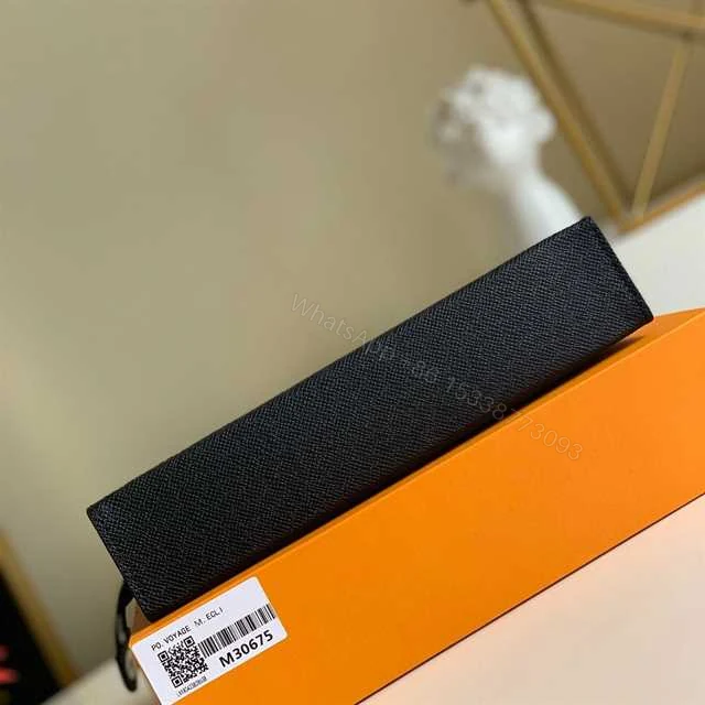 View 9 of LOUIS VUITTON POCHETTE VOYAGE MM TAIGA LEATHER M30675