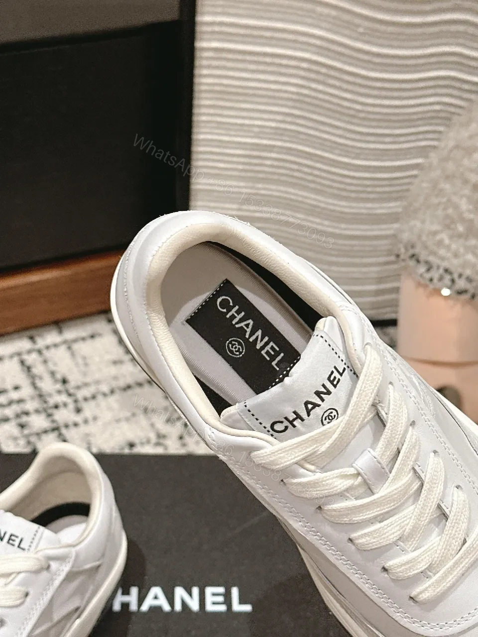 View 4 of Minimalist White Leather Sneakers with Subtle Chanel Detailing