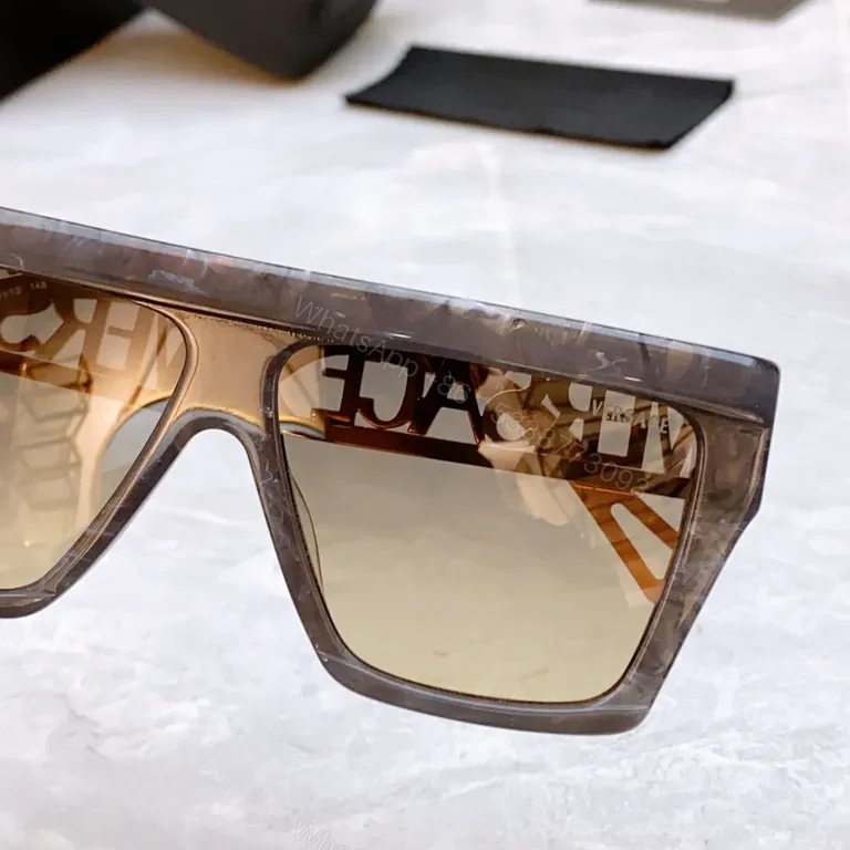 View 9 of Bold Black & Gold Luxe Sunglasses - Statement Frame, All-Day Comfort