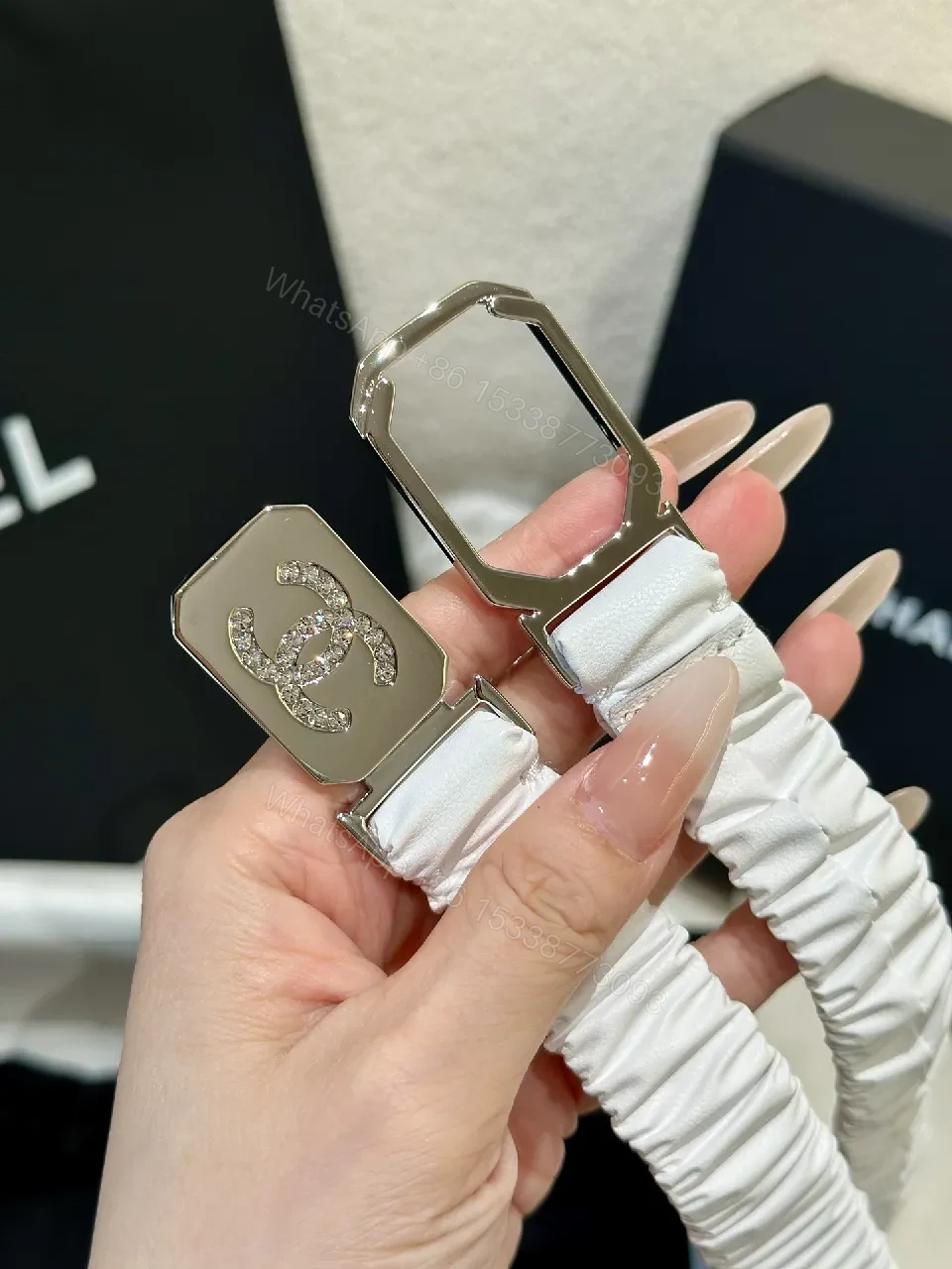 View 3 of Lux White Strap Belt-Style Watch: Pavé Logo Bezel