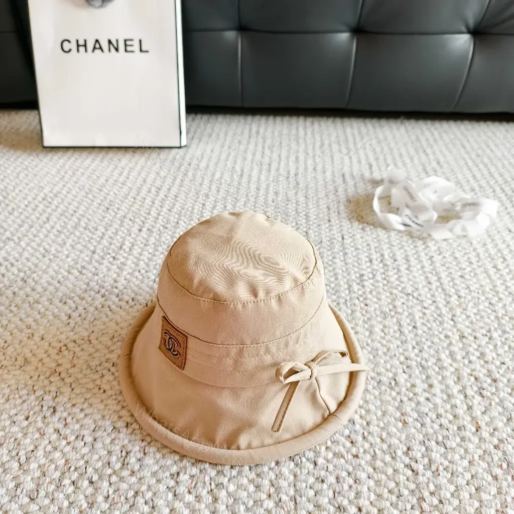 View 2 of Beige Lightweight Bucket Hat with Logo Detail