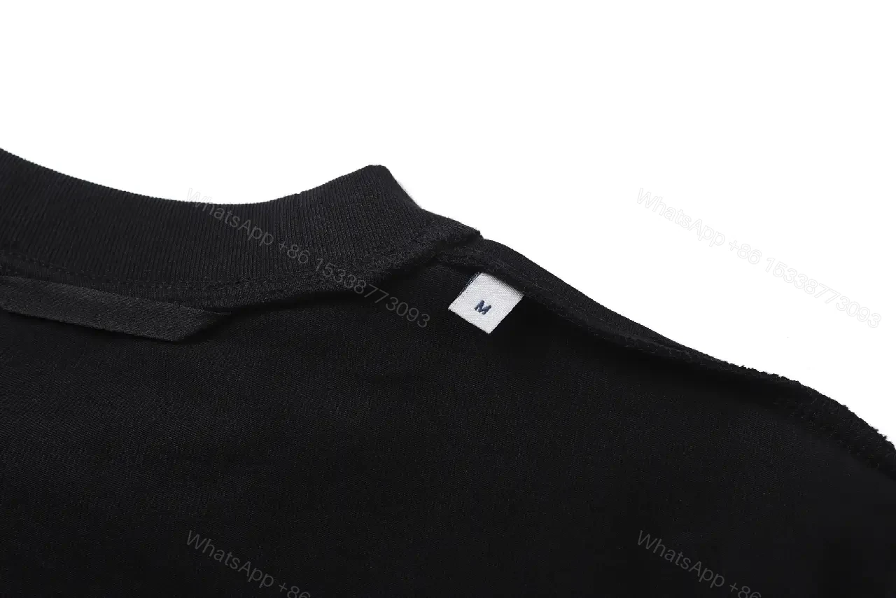 View 3 of Black Cotton Tee with Crest – Subtle Luxe Streetwear Top