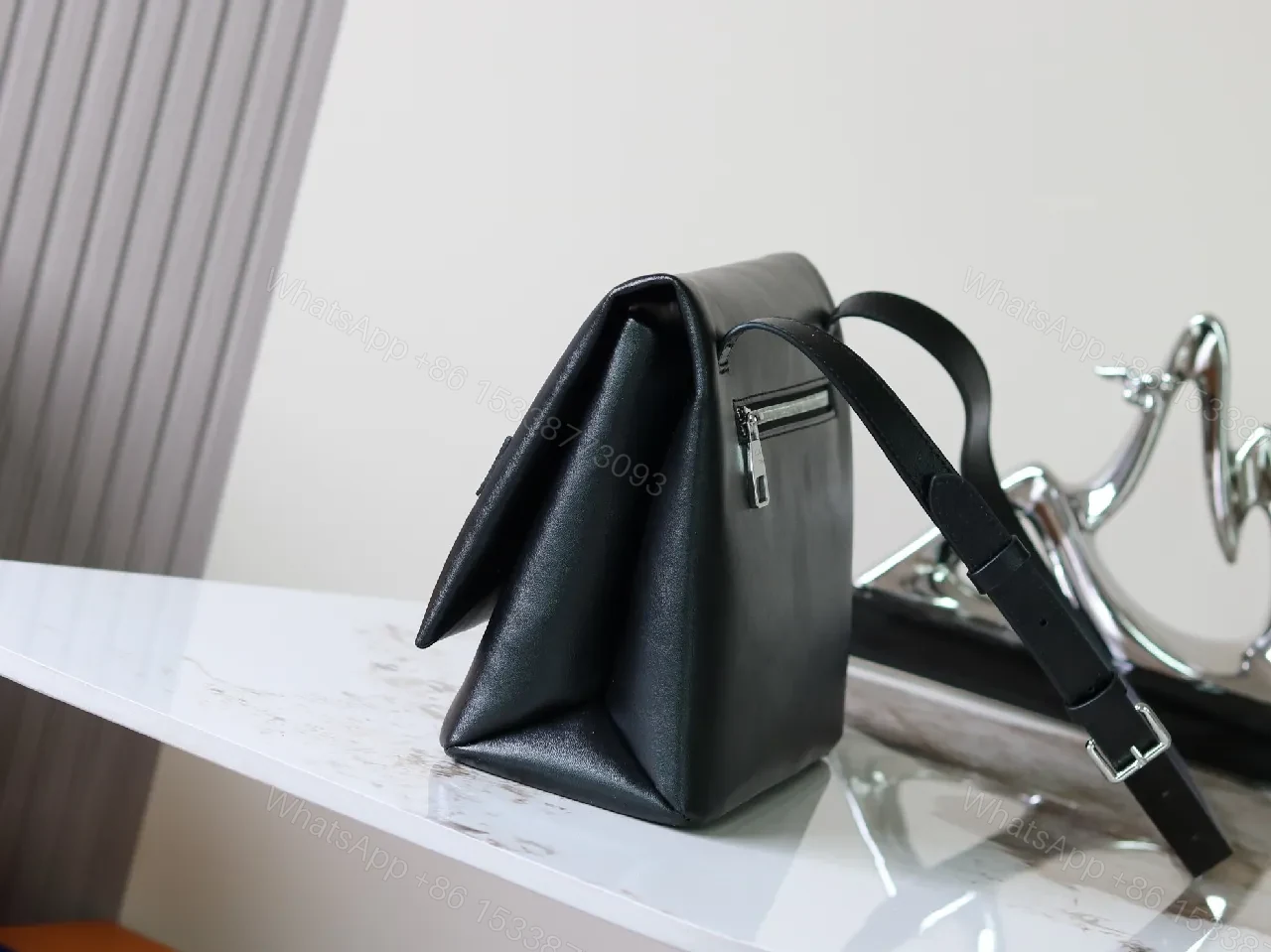 View 3 of Structured Minimalist Clutch: Luxe Faux Leather, Embossed Logo, Magnetic Closure