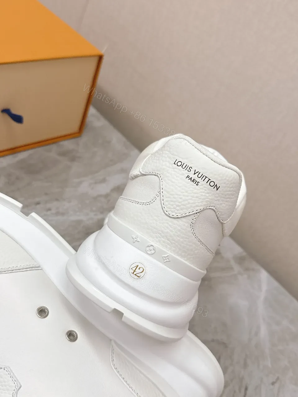 View 2 of White Leather Low-Profile Sneakers with Monogram Detailing
