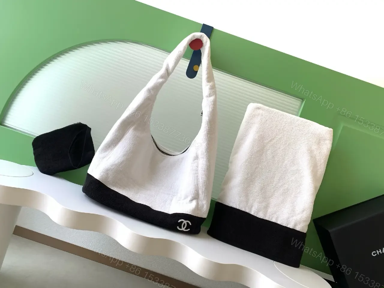 View 8 of White Fabric Handbag with Black Trim Slouchy Style Chanel Logo Tote