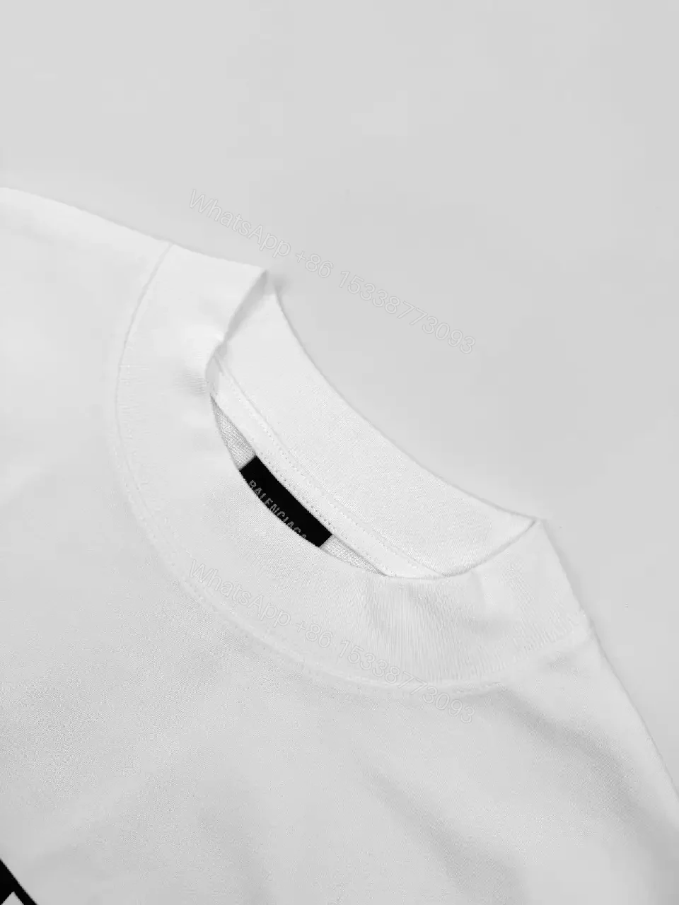 View 7 of White Cotton Minimalist Logo Tee with Signature Graphic
