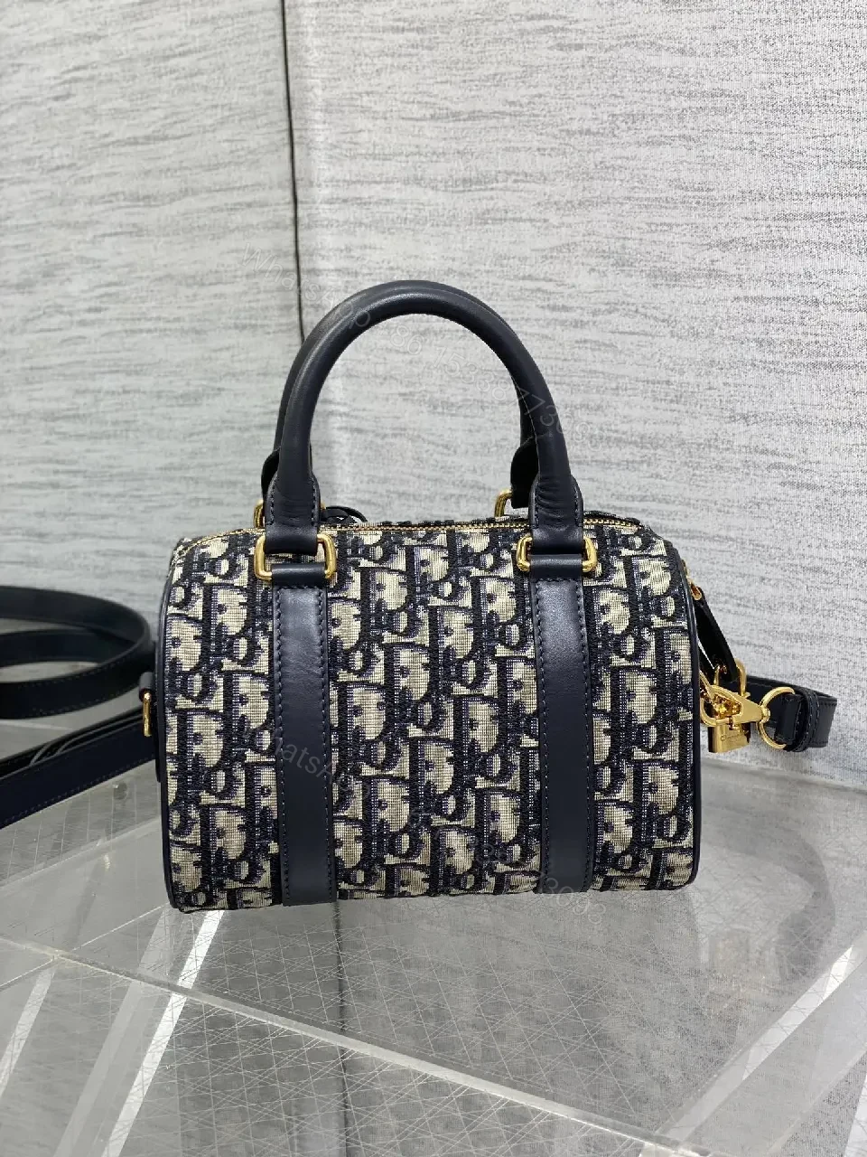 View 8 of Structured Luxe Navy Leather Mini Duffle Bag with Monogram Charm