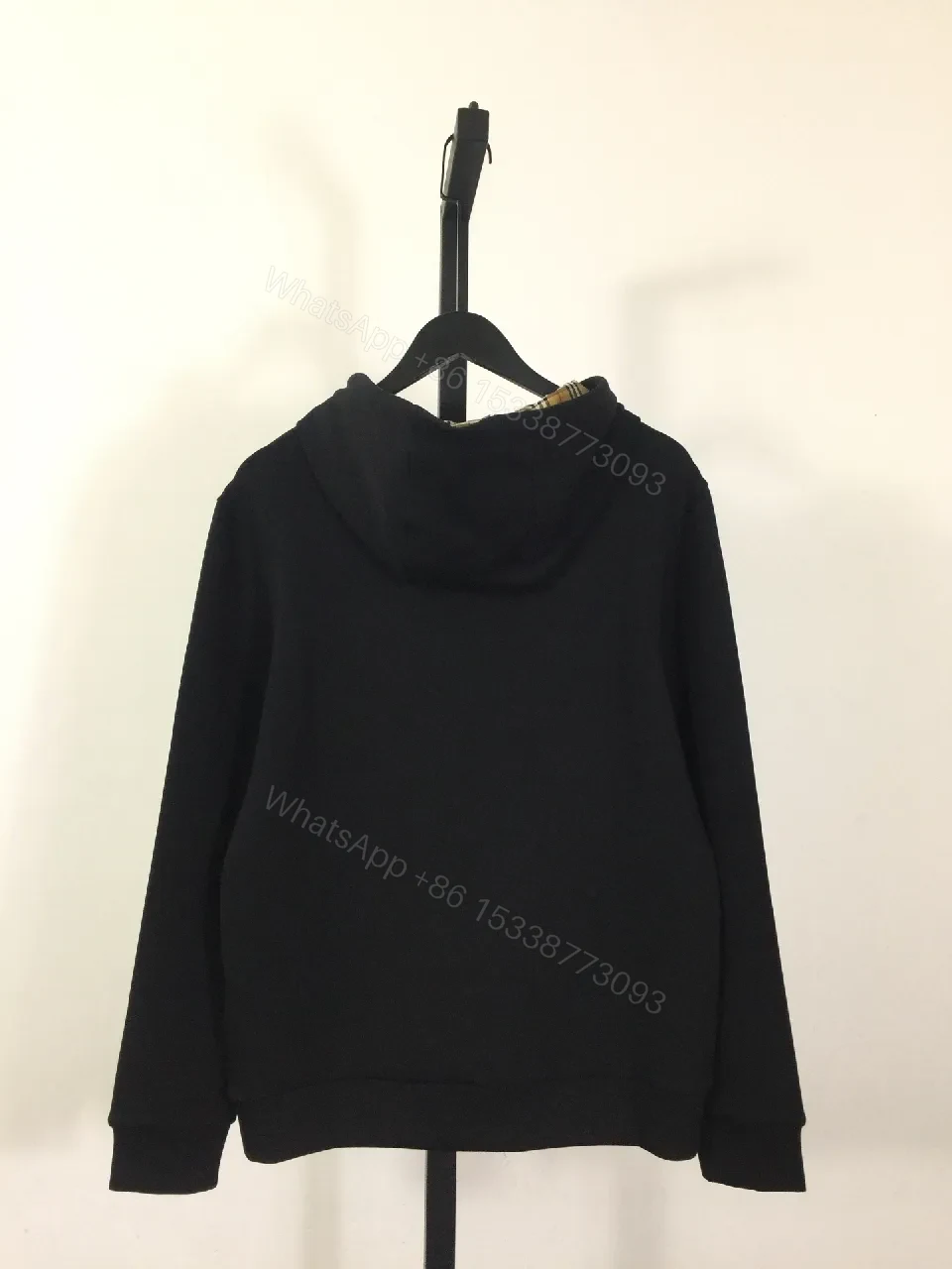 View 7 of Minimalist Black Hoodie with Gold Logo – Premium Casual Wear