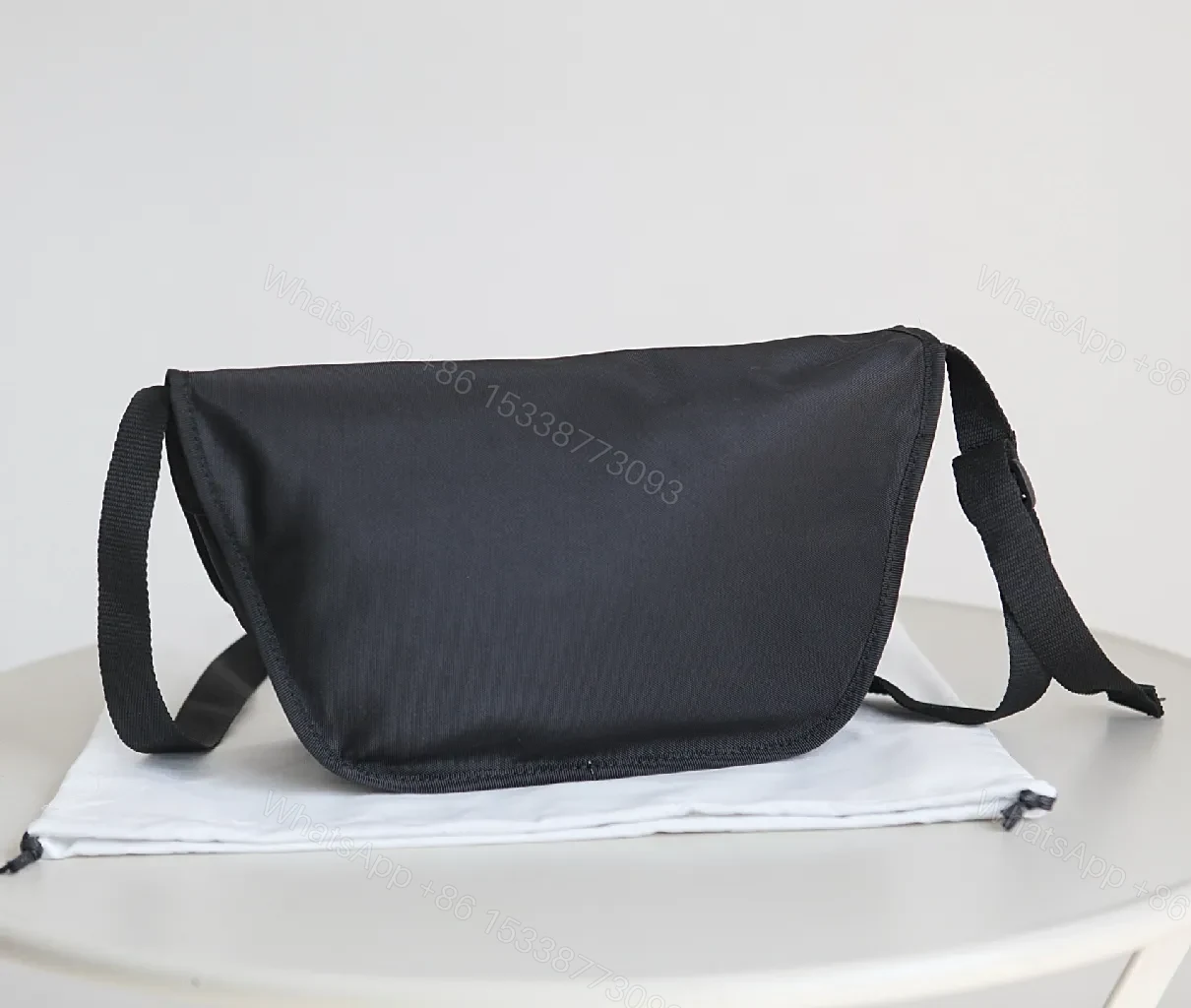 View 8 of Black Durable Matte Nylon Messenger Bag – Compact, Adjustable Strap, Minimalist Style