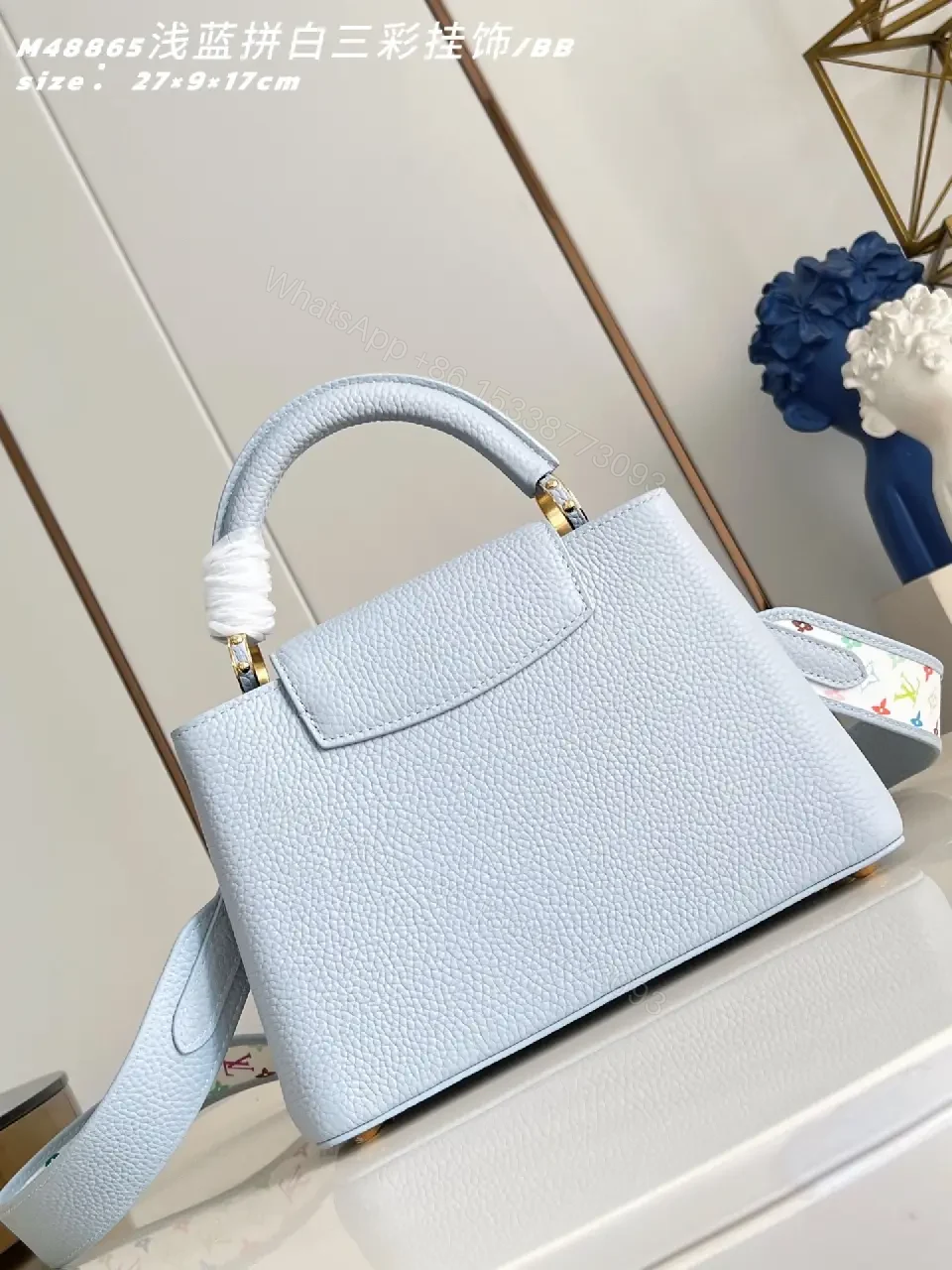 View 2 of Light Blue Leather Handbag with Gold Hardware Details