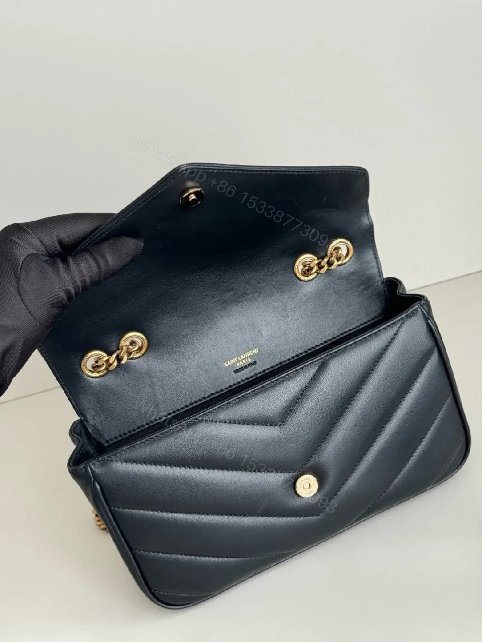 View 8 of Quilted Leather Crossbody Bag with Gold Emblem, Luxury Style