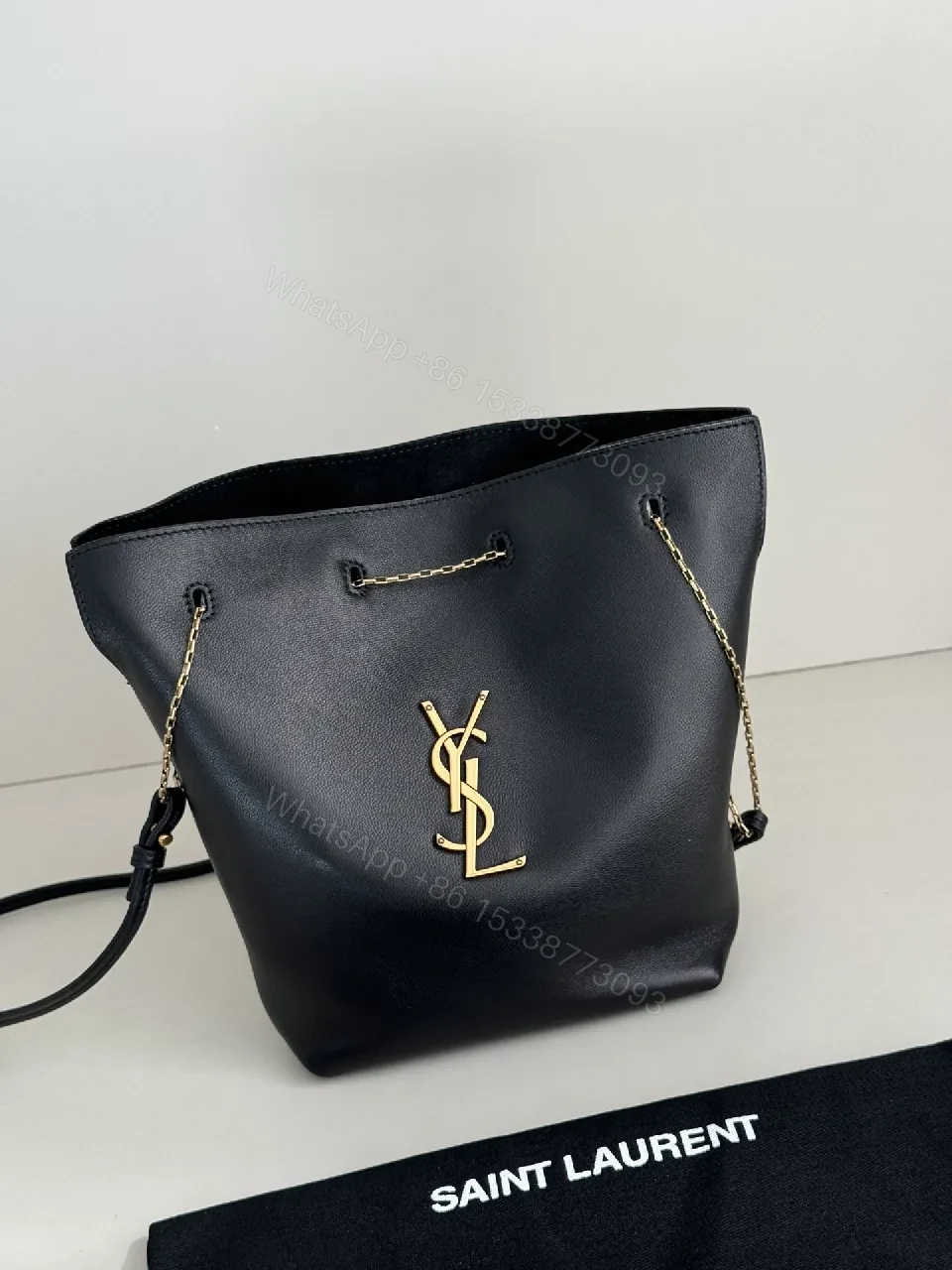 Chic Black Leather Bucket Bag with Gold Logo — view 1
