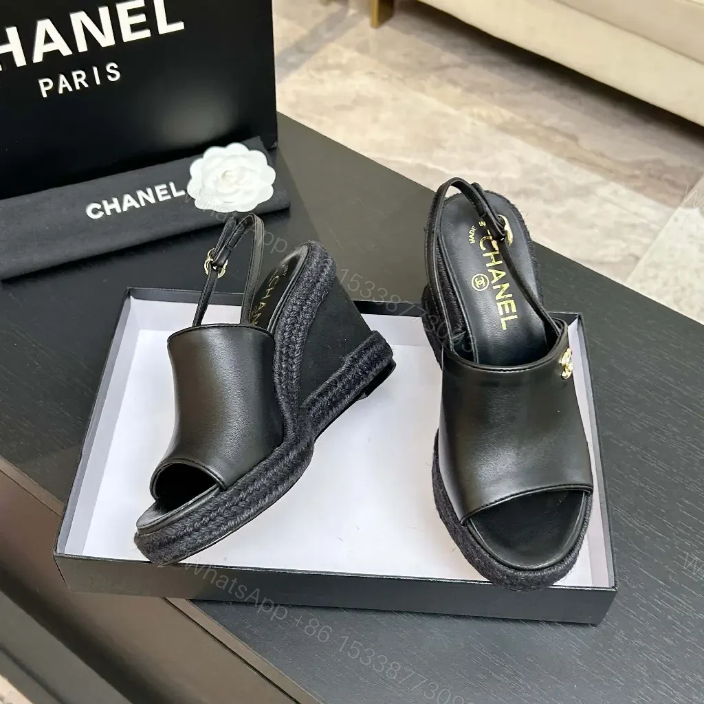 View 9 of Chic Black Leather Wedge Sandals - Gold Emblem, Open Toe, Slingback