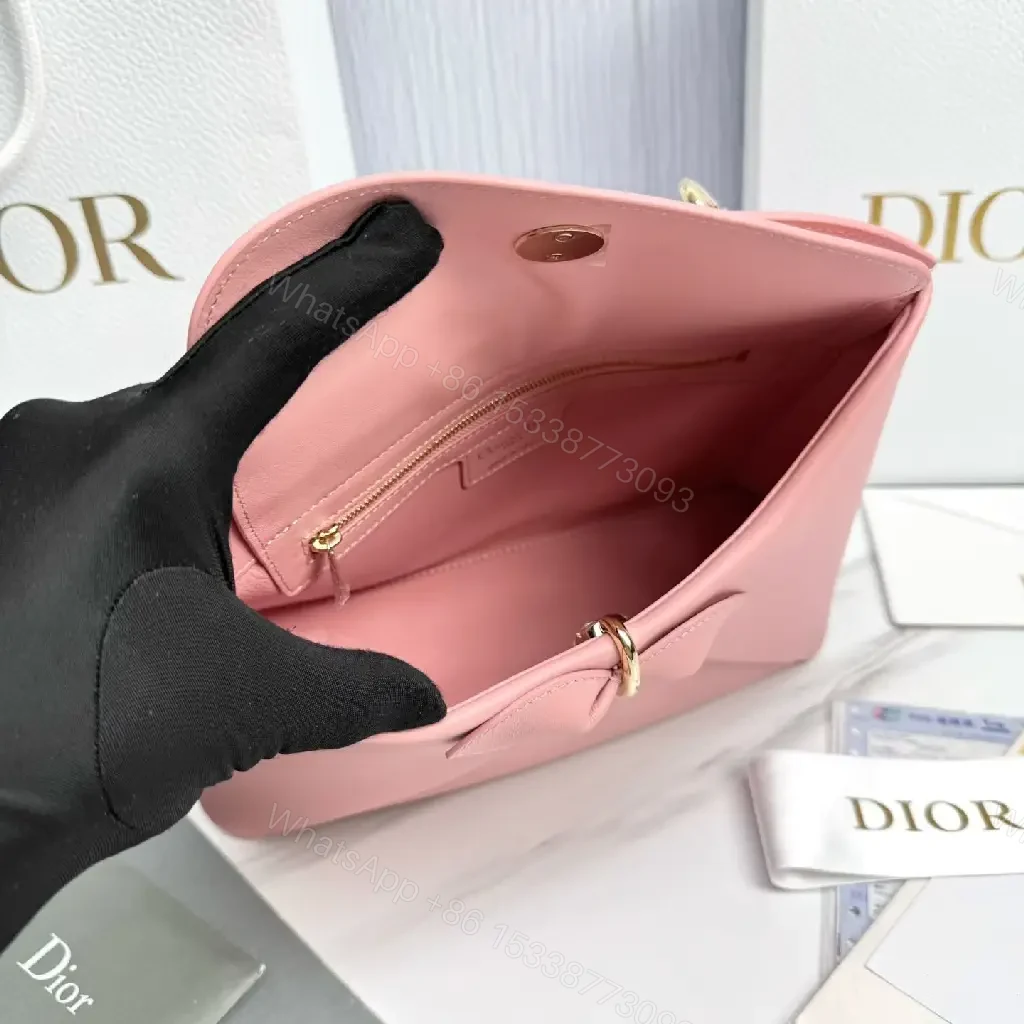 View 7 of Soft Pink Faux-Leather Satchel: Bow Accent, Sculpted Diagonal Panels, Crossbody Comfort