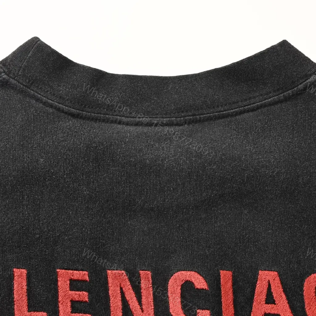 View 4 of Minimalist Black Cotton Tee with Subtle Red Embroidery