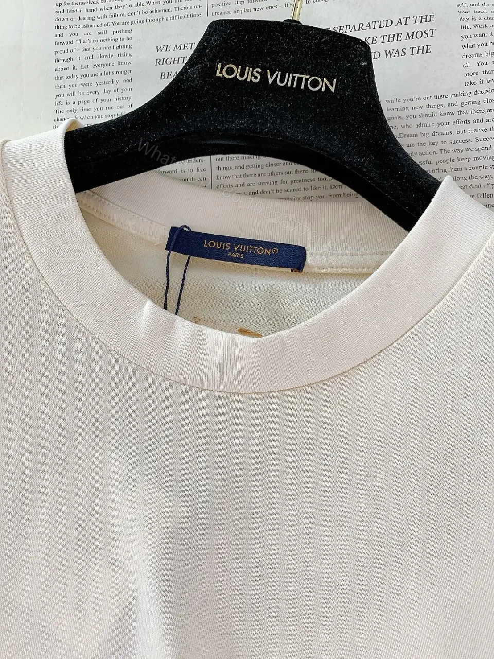 View 10 of Minimalist Off-White Cotton Tee with Signature L.V.M. Accent
