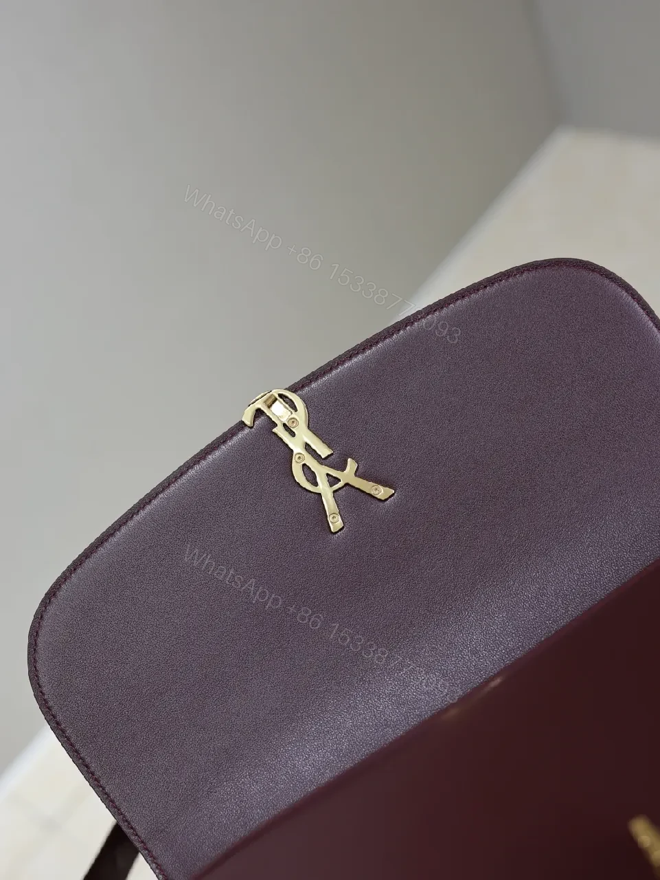 View 9 of Structured Burgundy Leather Crossbody: Gold Logo, Modern Chic
