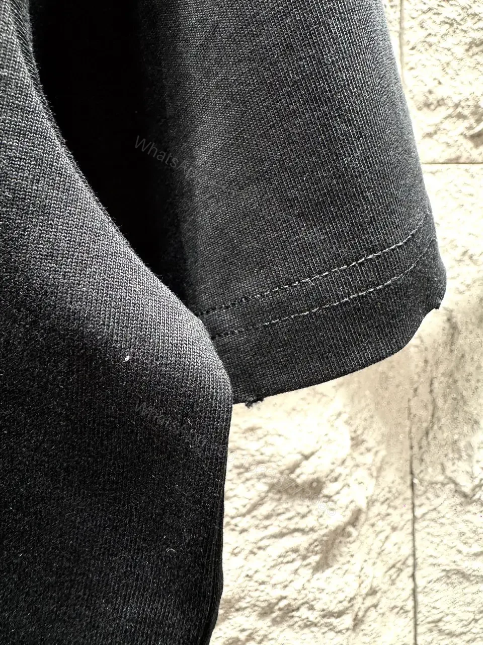 View 4 of Black Cotton Tee with Subtle Embroidered Graphic, Minimal Luxury, Everyday Wear