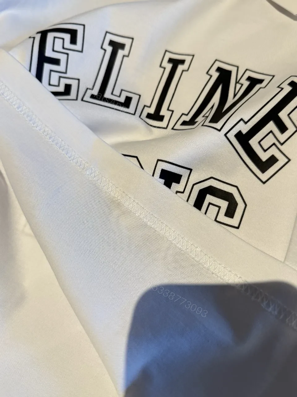View 7 of White Cotton Modern Tee: Bold Logo, Premium Comfort, Everyday Style