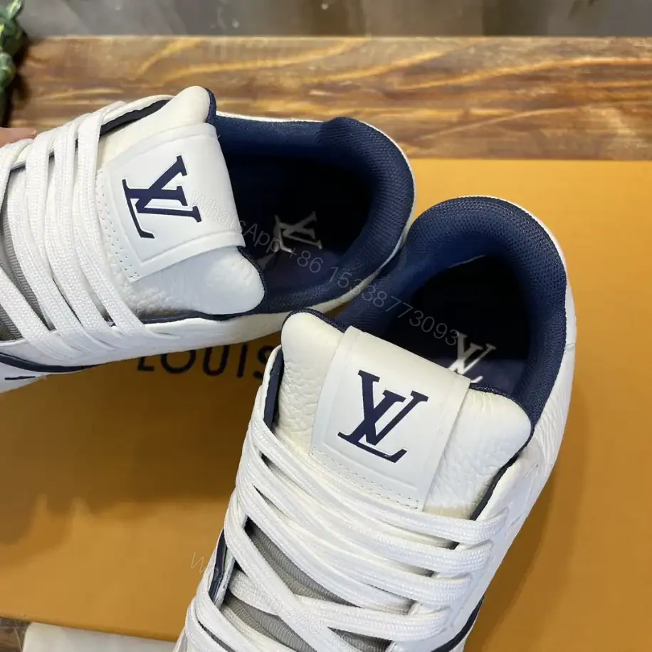 View 7 of LOUIS VUITTON LV TRAINER SNEAKERS IN WHITE AND NAVY BLUE – LSVT353
