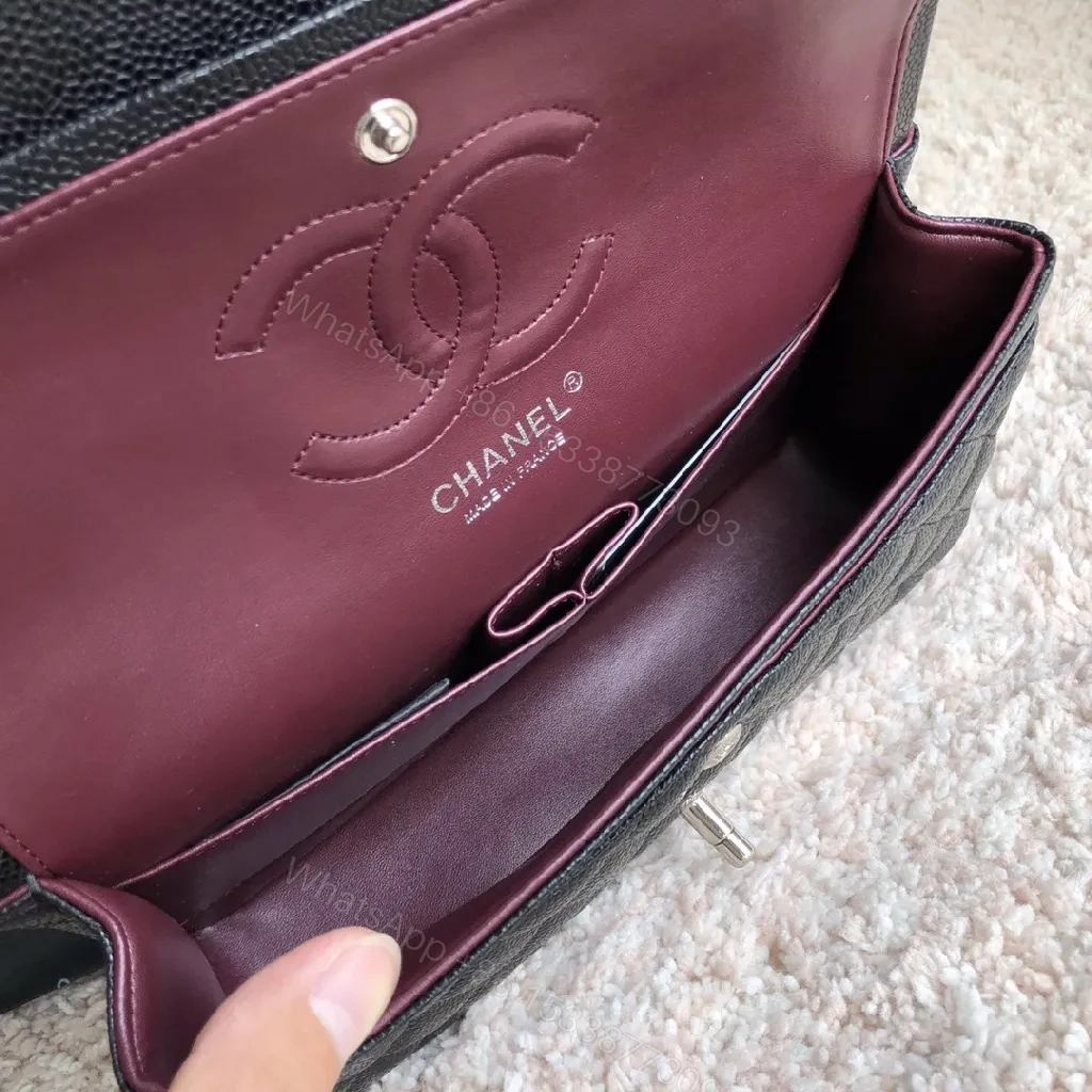 View 2 of Quilted Black Flap Bag with Silver Turn-Lock – Luxury Style