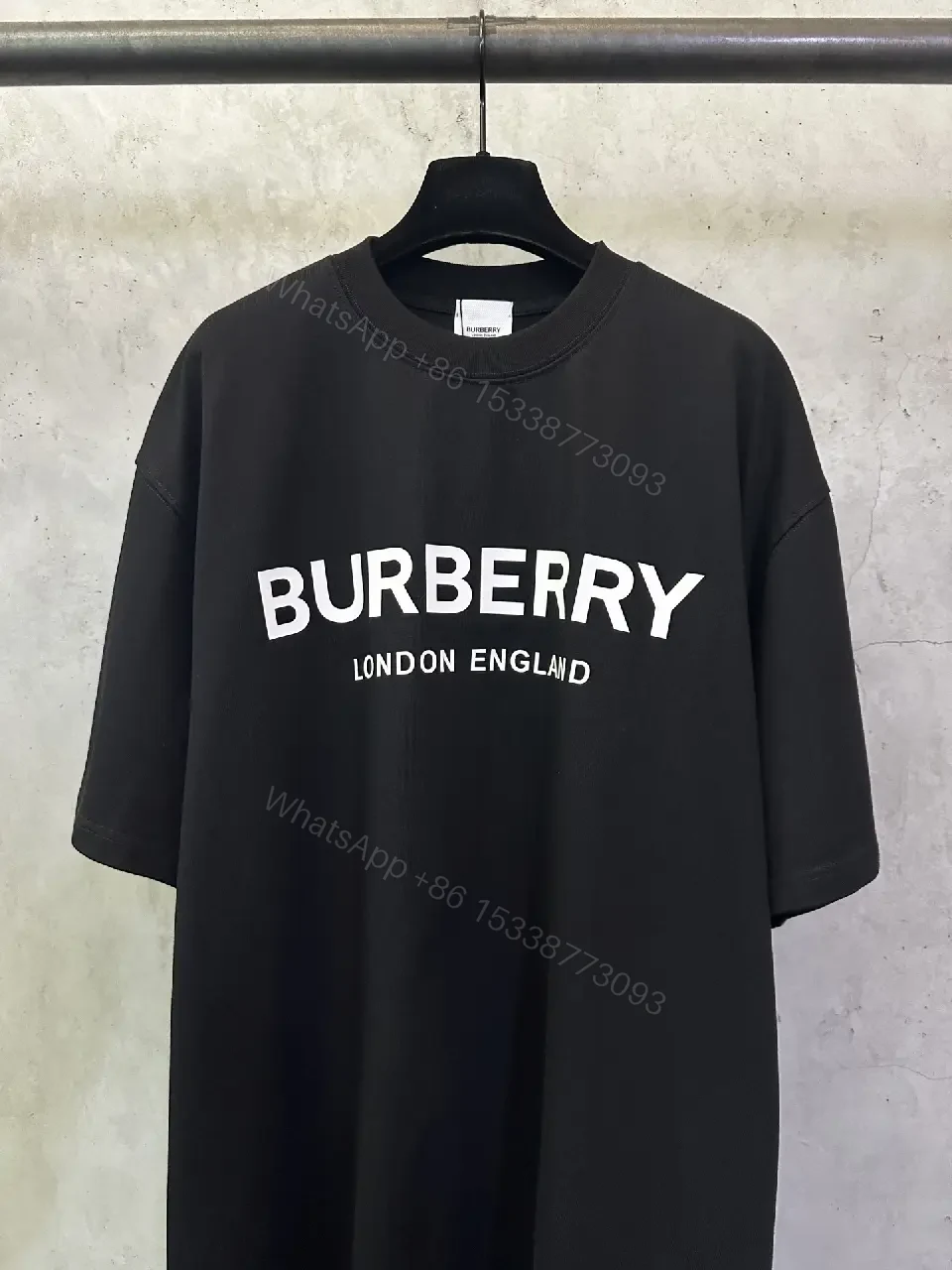 View 8 of Oversized Black Logo Cotton Tee – Modern Streetwear Essential