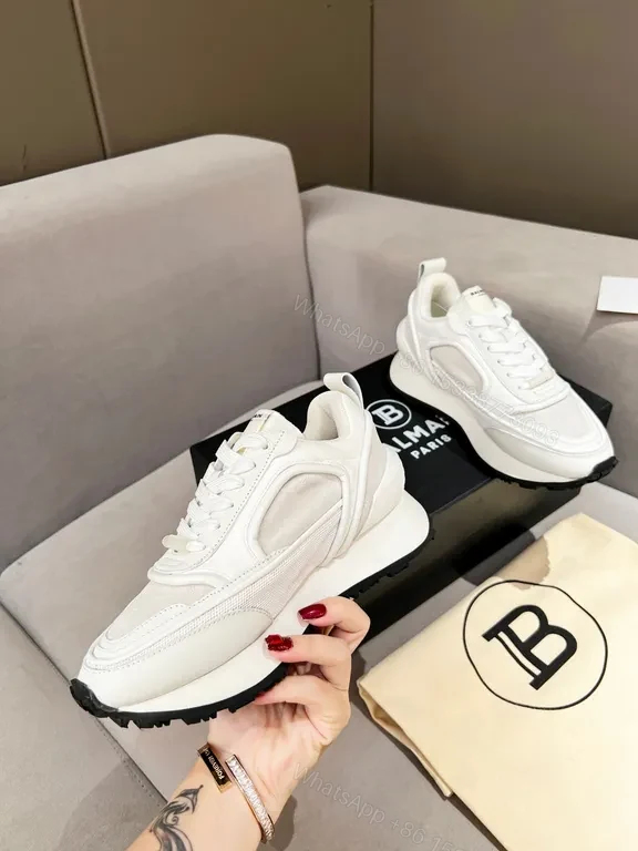 View 7 of Chic White Balmain High-Top Sneakers: Luxe Comfort