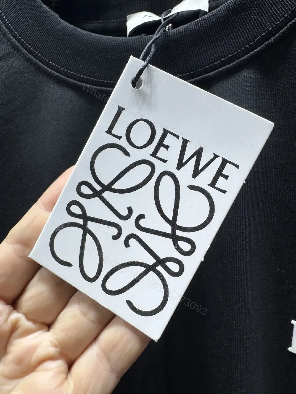 View 6 of Black Cotton Tee with Subtle Embroidered Graphic, Minimal Luxury, Everyday Wear