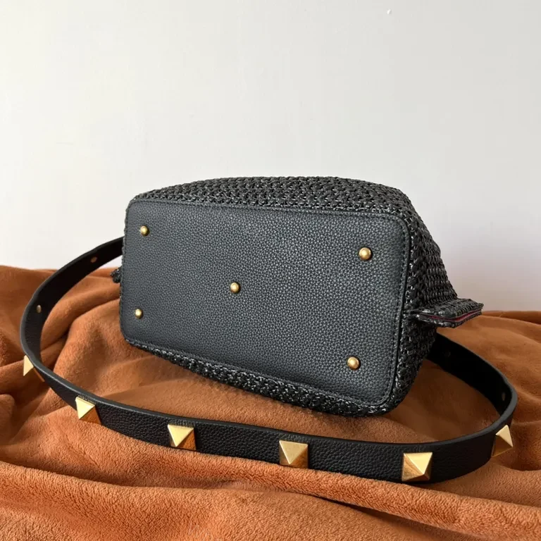 View 5 of Black Woven Luxe Handbag: Compact, Gold-Accent Style Bag