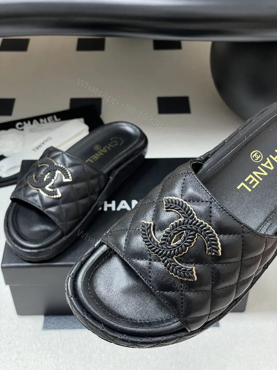 View 5 of Quilted Black Slip-Ons with Gold Emblem – Luxe Style