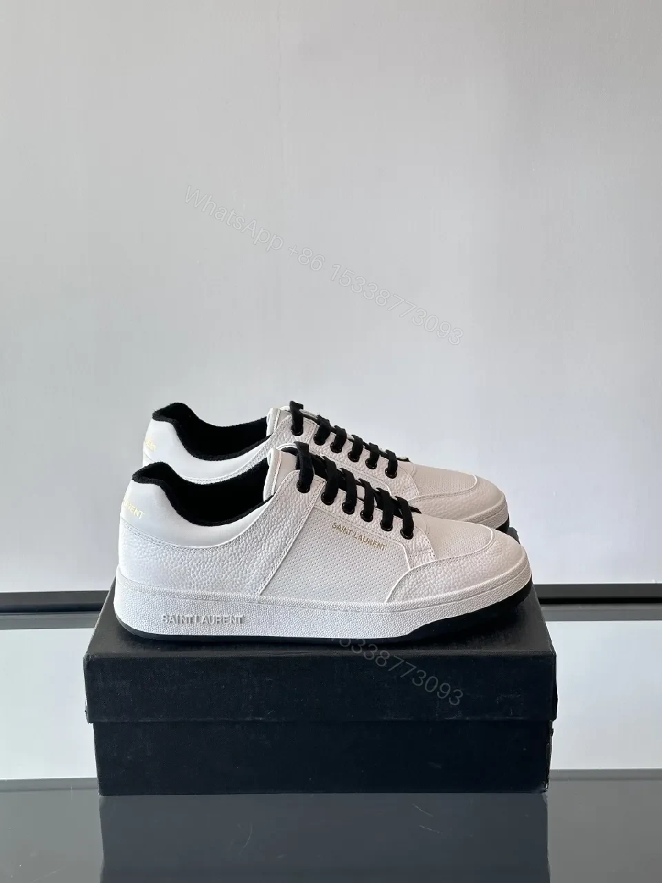 View 3 of White Leather Sneaker with Black Accents — Minimalist Luxury Sneaker