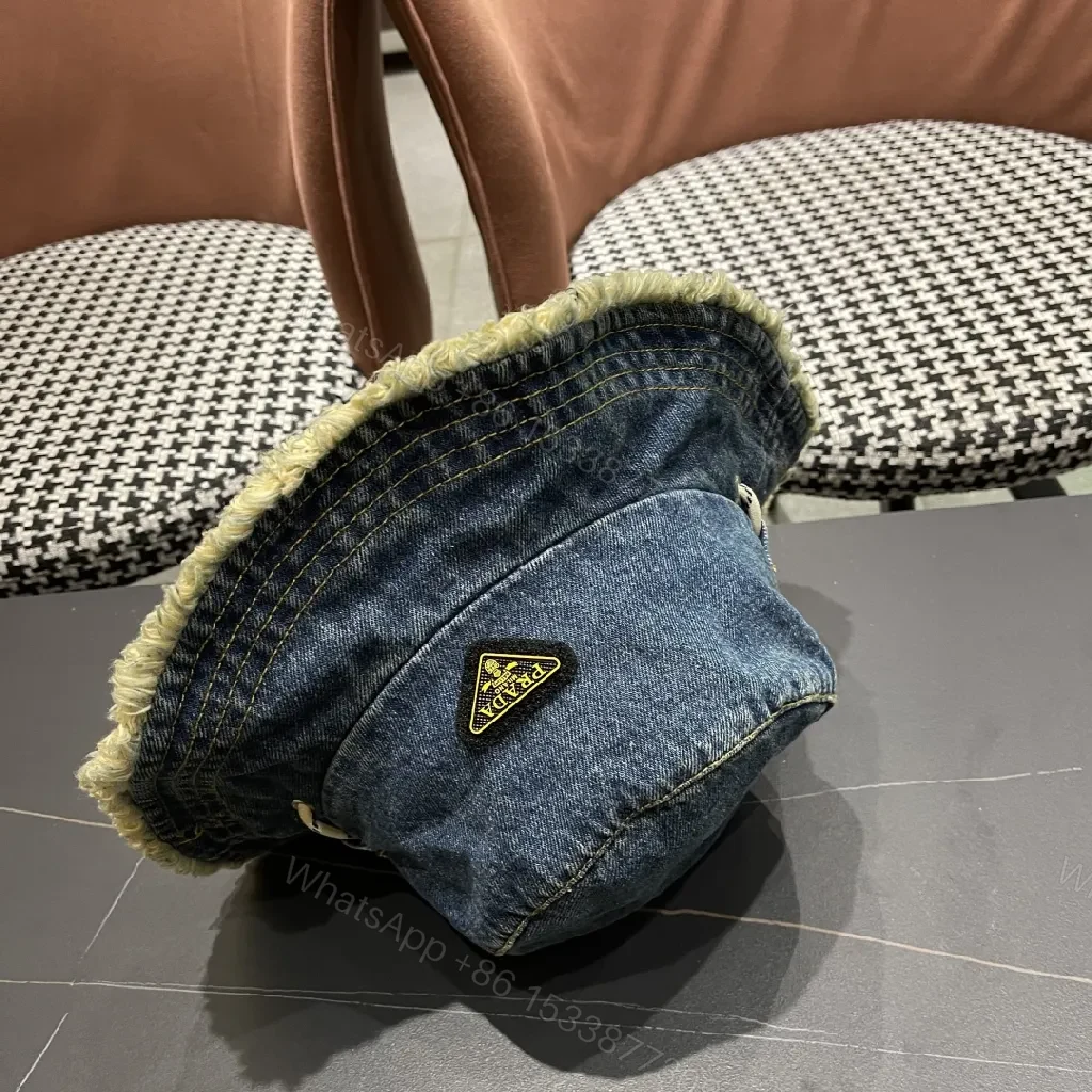 View 11 of Denim Bucket Hat + Distressed Edge + Modern Luxury + Subtle Prada-Inspired Badge + Hat