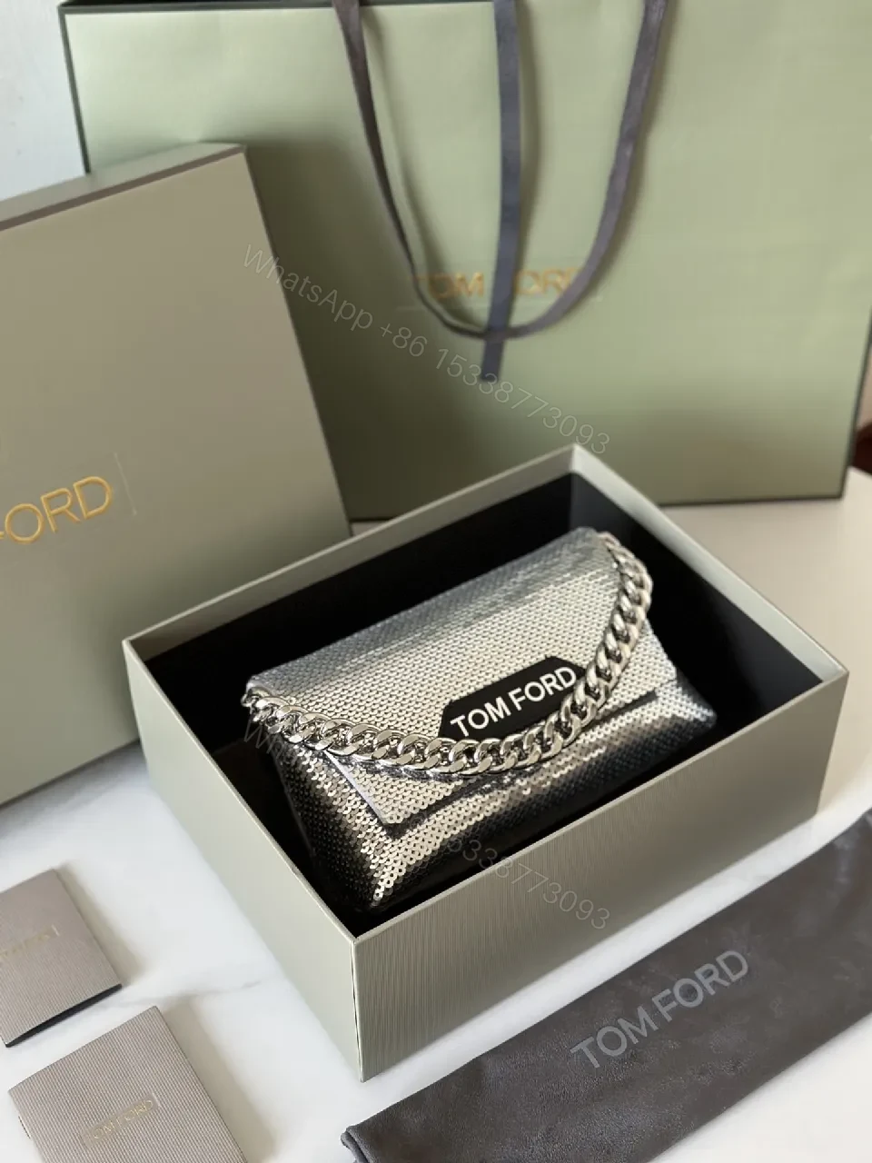 View 9 of Chic Metallic Crossbody Clutch: Bold Chain Luxury