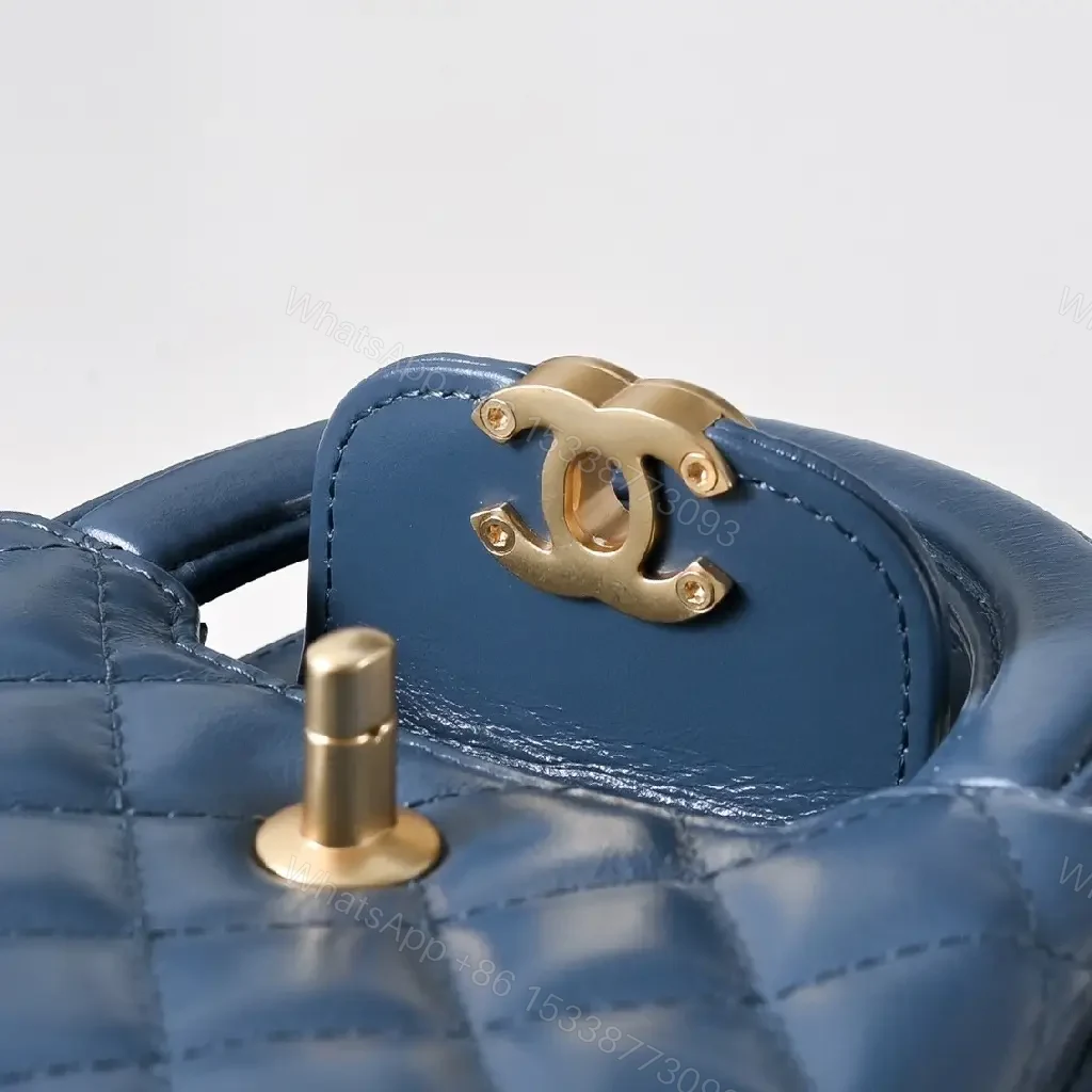 View 10 of Compact Blue Quilted Satchel with Gold Clasp Bag