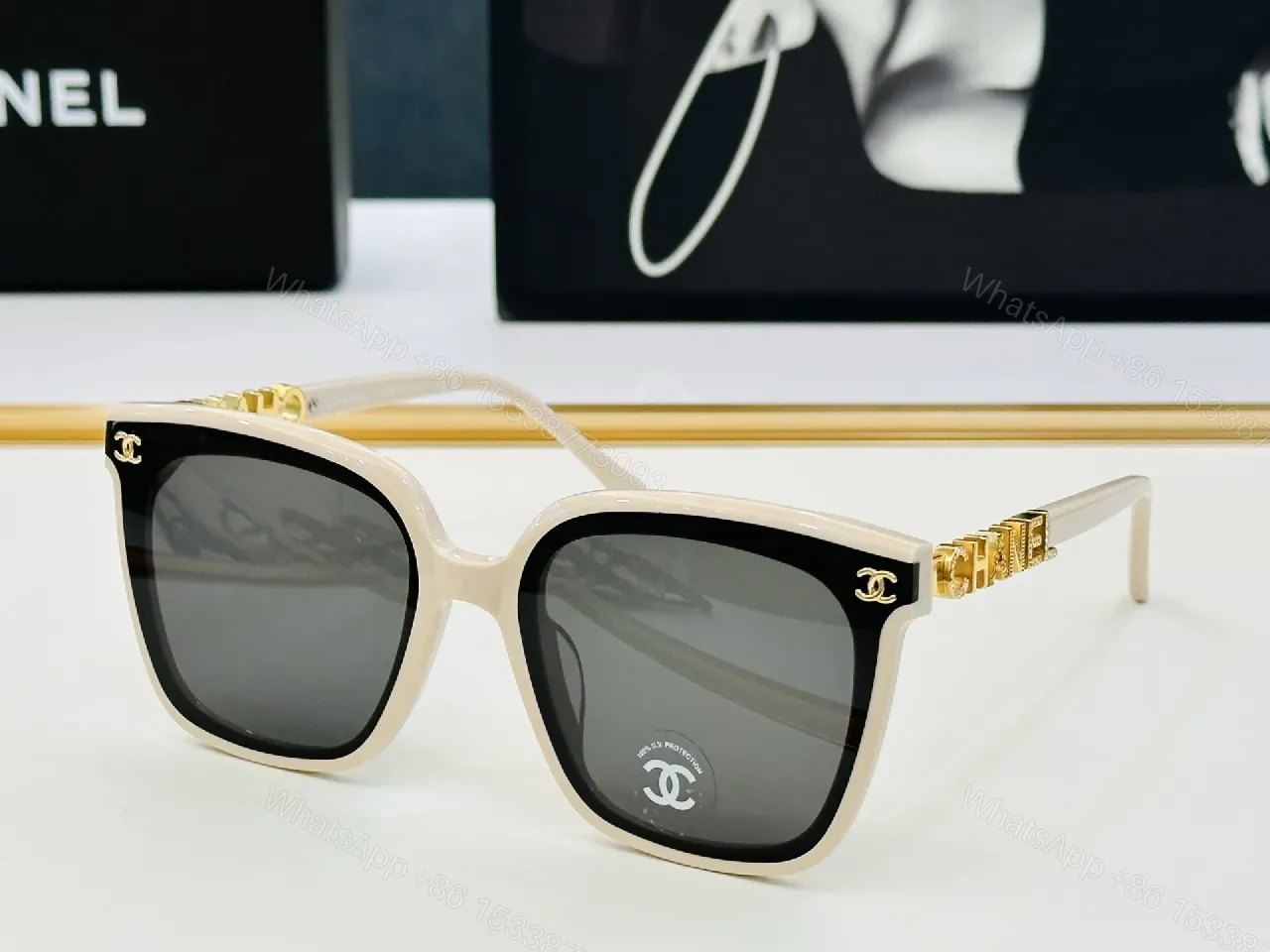 View 8 of Bold Black Frame Sunglasses with Gold Detailing