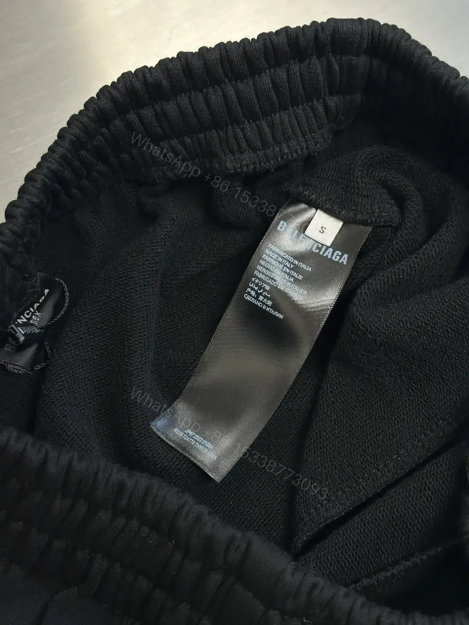 View 7 of Chic Black Wide-Leg Track Pants with Subtle Logo