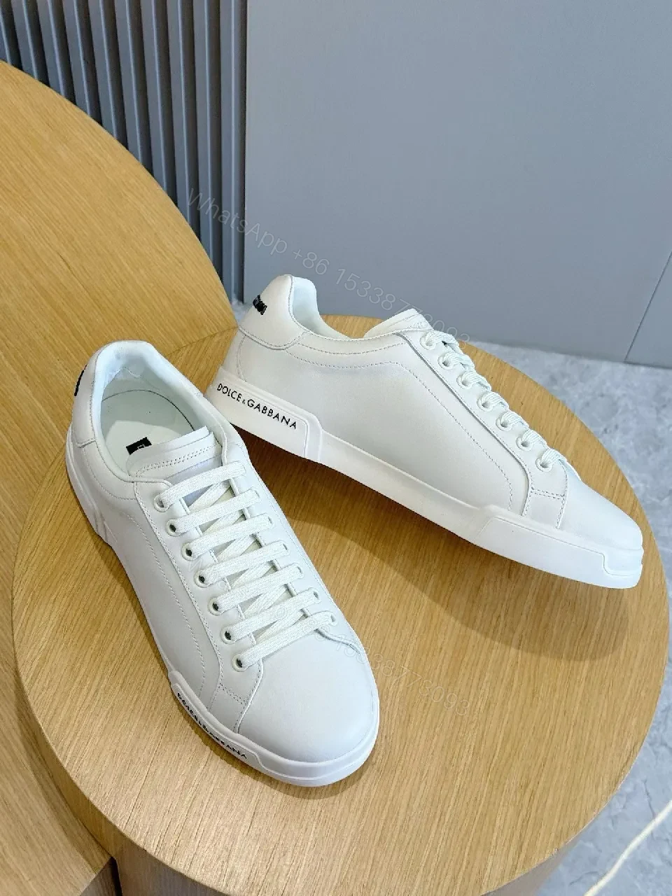 View 8 of Minimal White Leather Sneakers with Subtle Designer Detailing