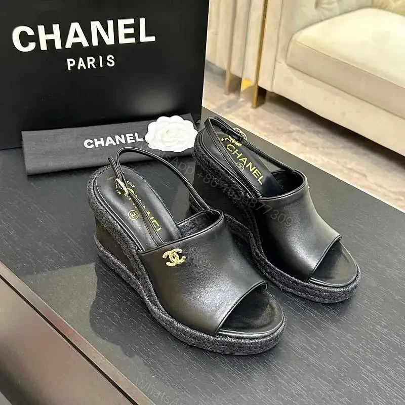 Chic Black Leather Wedge Sandals - Gold Emblem, Open Toe, Slingback — view 1
