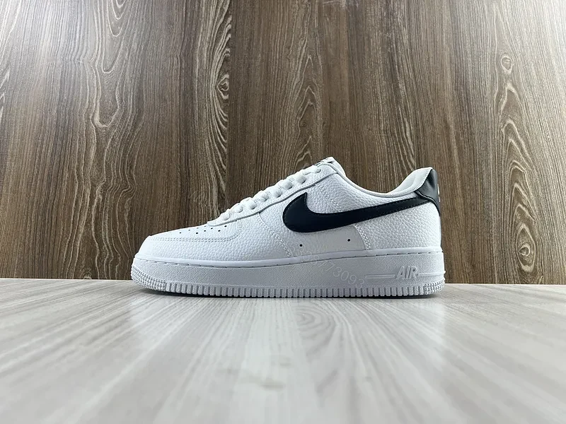 White Leather Sneaker + Leather + Minimalist + Bold Swoosh + Classic Air Force Style — view 1
